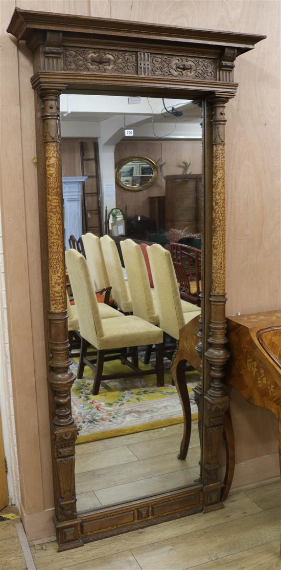 An Arts and Crafts rectangular wall mirror after the Regency manner with frieze featuring two panels of Mannerist scrolls,